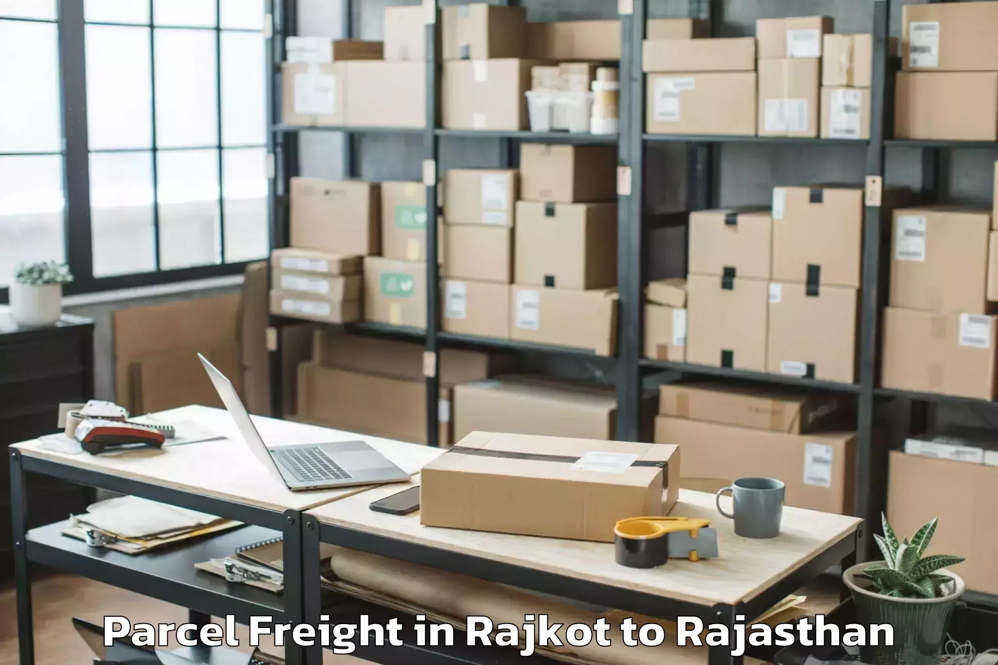 Trusted Rajkot to Dr Kn Modi University Newai Parcel Freight